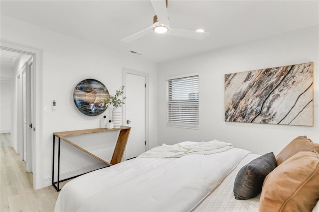 bedroom featuring light wood-type flooring and ceiling fan