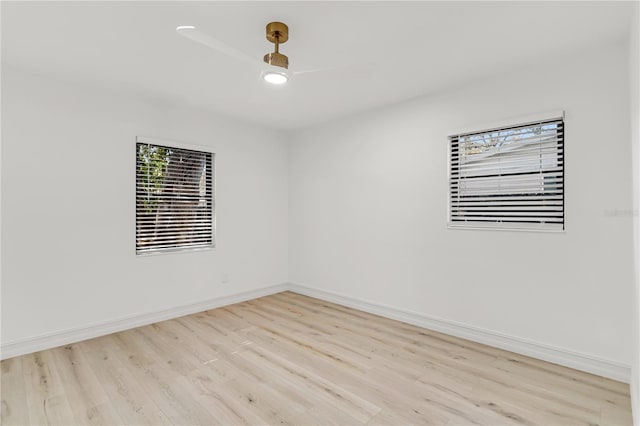 unfurnished room with ceiling fan and light hardwood / wood-style flooring