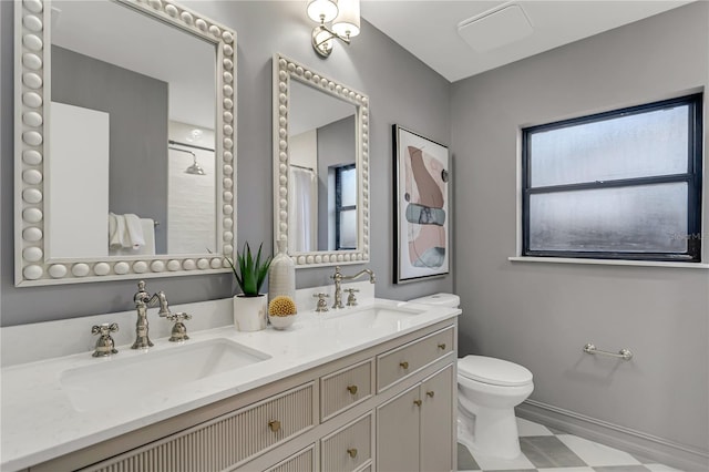 bathroom featuring a shower with curtain, vanity, and toilet