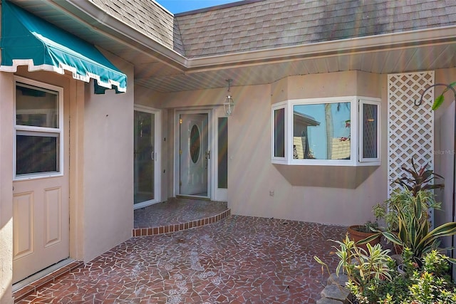 entrance to property with a patio