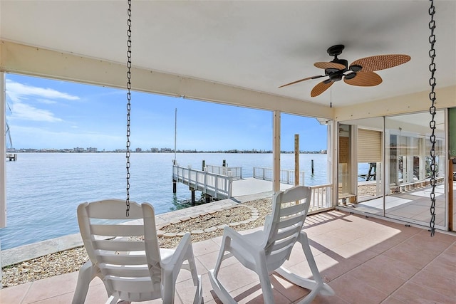 dock area featuring a patio and a water view