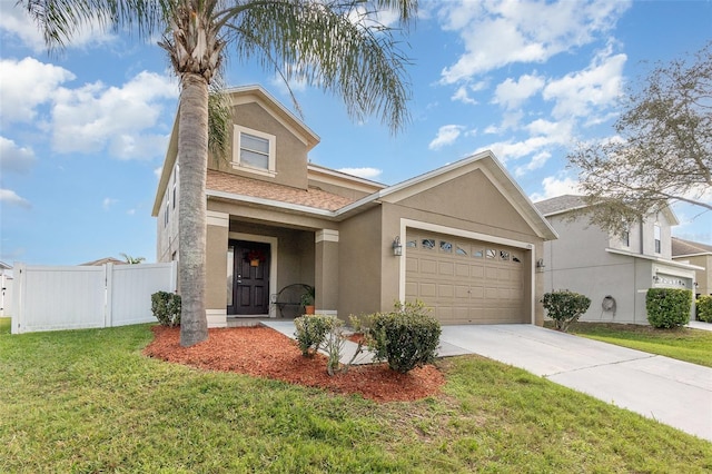 view of front of house with a garage, fence, driveway, stucco siding, and a front lawn