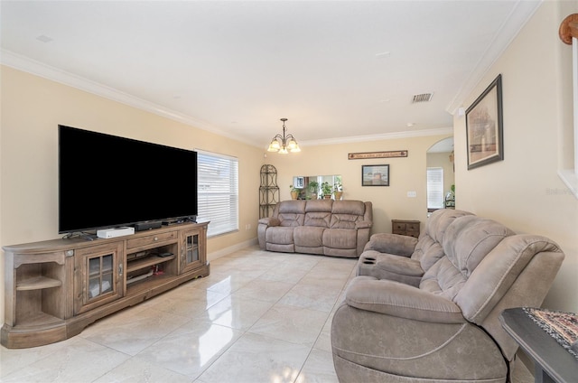 living area featuring a chandelier, arched walkways, visible vents, and crown molding