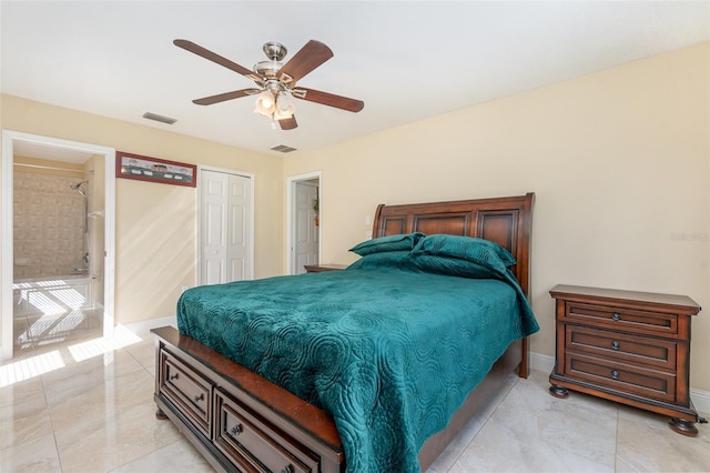 bedroom featuring marble finish floor, a closet, visible vents, and a ceiling fan