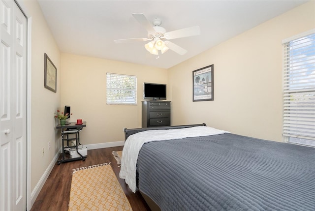 bedroom featuring a ceiling fan, dark wood finished floors, and baseboards