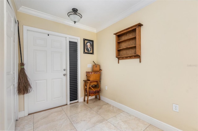 foyer entrance with light tile patterned floors, baseboards, and ornamental molding