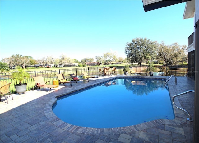 view of pool featuring fence, a fenced in pool, and a patio