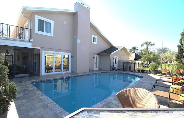 view of swimming pool with fence, a fenced in pool, and a patio