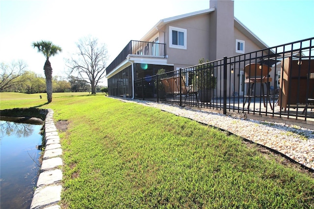 exterior space with a balcony and fence