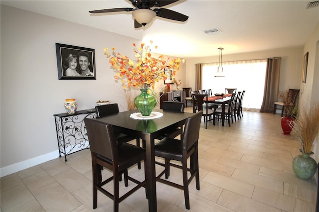 dining area featuring ceiling fan, visible vents, and baseboards