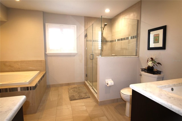 full bath with a stall shower, baseboards, vanity, and toilet