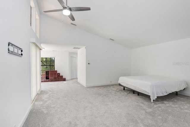 bedroom featuring high vaulted ceiling, ceiling fan, and light colored carpet