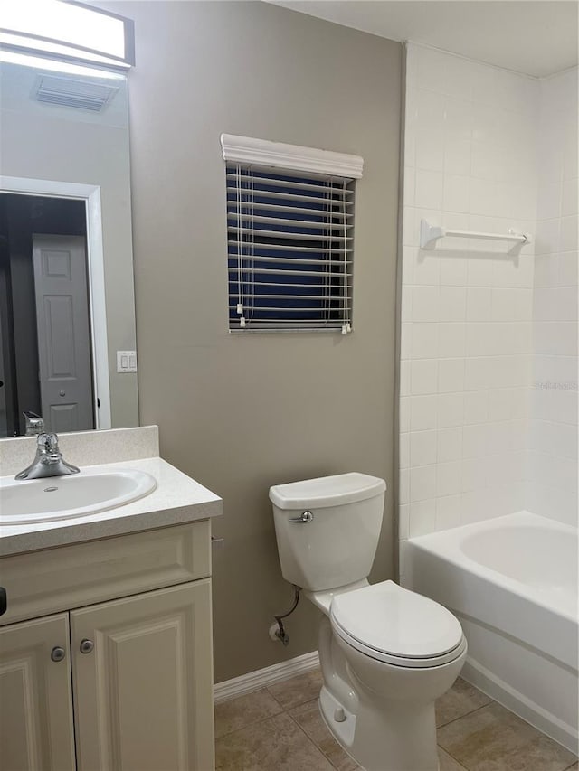 full bathroom featuring tile patterned floors, shower / bath combination, vanity, and toilet