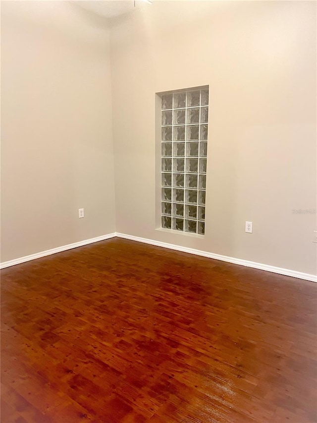 unfurnished room with hardwood / wood-style floors