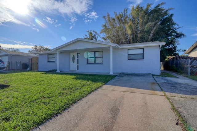 ranch-style house with a front lawn