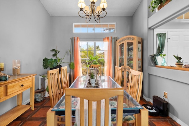 13542 Summerwood Ct, Hudson, FL 34667 - tiled dining room with a notable chandelier