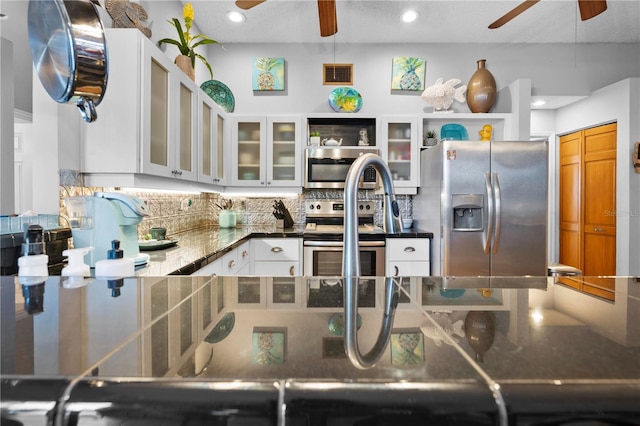 13542 Summerwood Ct, Hudson, FL 34667 - kitchen featuring backsplash, appliances with stainless steel finishes, white cabinets, and ceiling fan