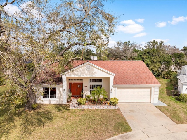 13542 Summerwood Ct, Hudson, FL 34667 - view of front of home with a front yard and a garage