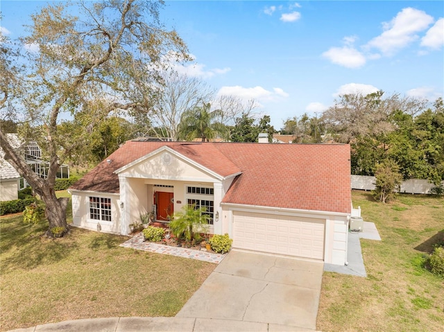 13542 Summerwood Ct, Hudson, FL 34667 - view of front of house with a front lawn and a garage