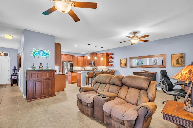 living area featuring recessed lighting, light tile patterned flooring, ceiling fan, and baseboards