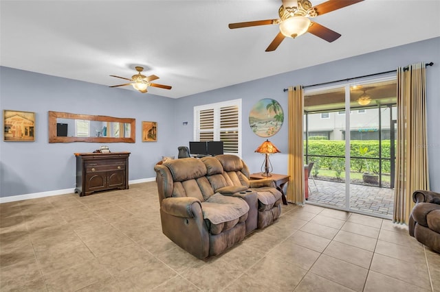 living room with a ceiling fan, light tile patterned flooring, and baseboards