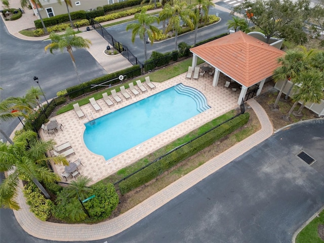 community pool featuring a patio area, fence, and a gazebo