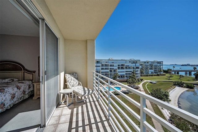 balcony featuring a water view