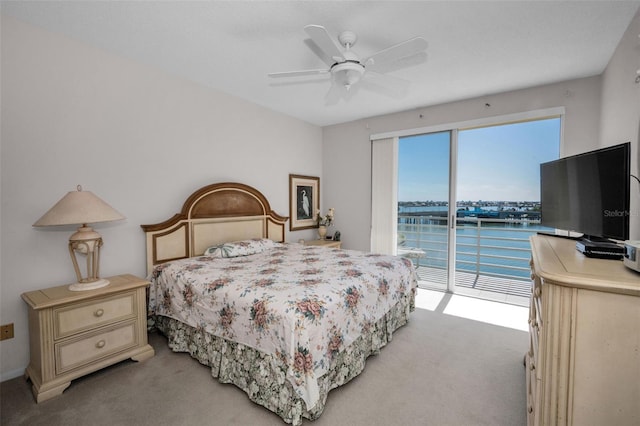 carpeted bedroom with access to exterior and ceiling fan