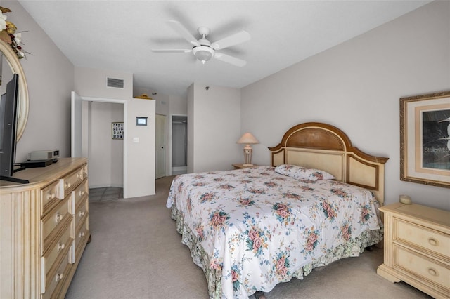 bedroom featuring light carpet, a closet, and ceiling fan