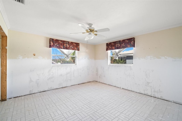 unfurnished room featuring ceiling fan, ornamental molding, and a wealth of natural light