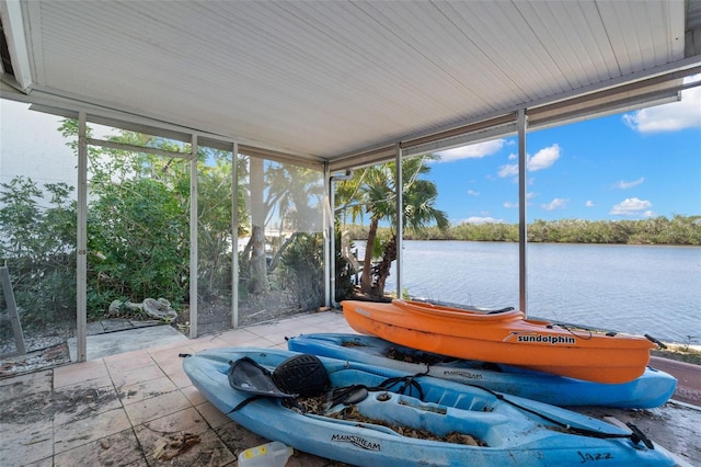 sunroom / solarium with a water view