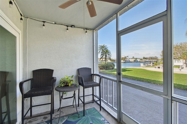 3717 46th Ave S Unit 7, Saint Petersburg, FL 33711 - sunroom featuring a water view and ceiling fan