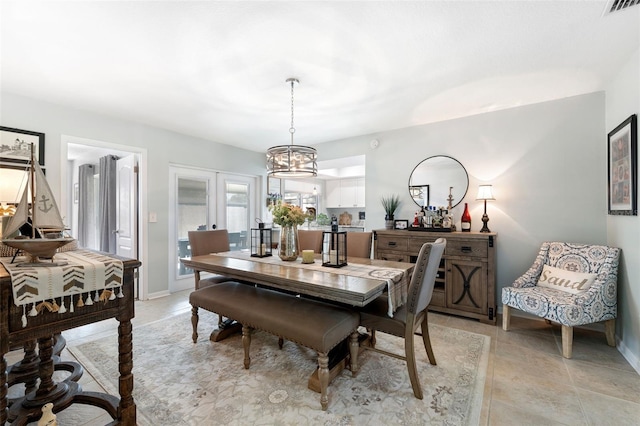 dining room with french doors, visible vents, and baseboards