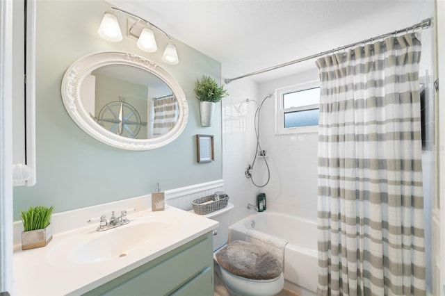 bathroom featuring toilet, shower / tub combo, and vanity