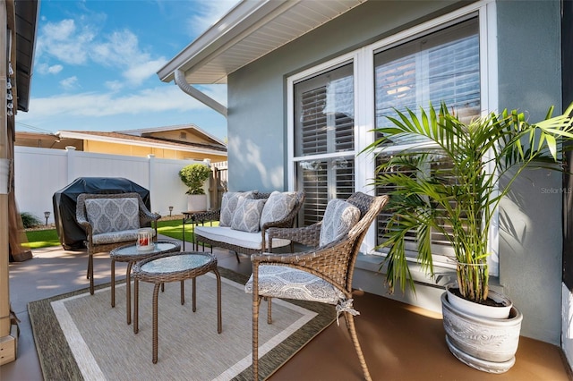 balcony featuring a patio area and an outdoor living space