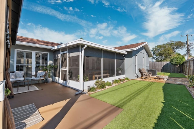 back of property featuring a patio area, fence, a sunroom, and central air condition unit