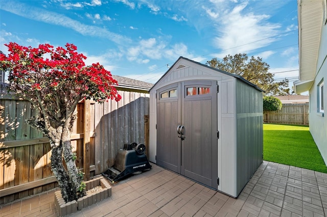 view of shed with a fenced backyard