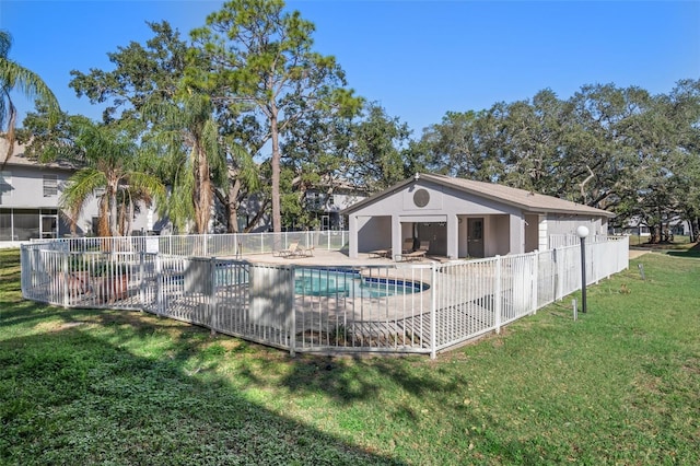 view of swimming pool with a patio area and a yard