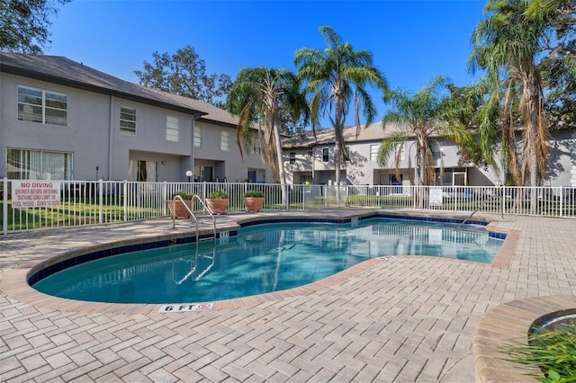 view of pool featuring a patio area