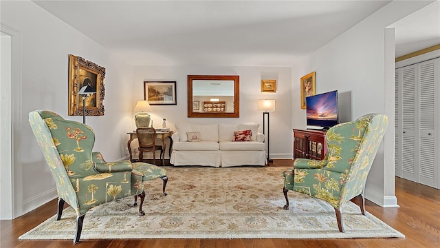 sitting room featuring wood finished floors and baseboards