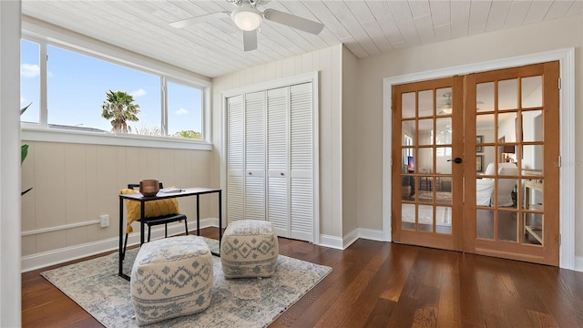 living area with wood ceiling, baseboards, dark wood-style flooring, and french doors