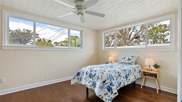 bedroom with dark wood-style floors, wood ceiling, baseboards, and a ceiling fan