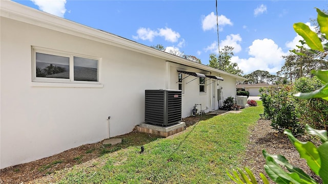 exterior space featuring central AC unit