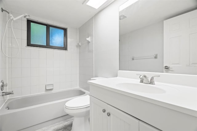 bathroom with visible vents, vanity, toilet, and shower / bathtub combination