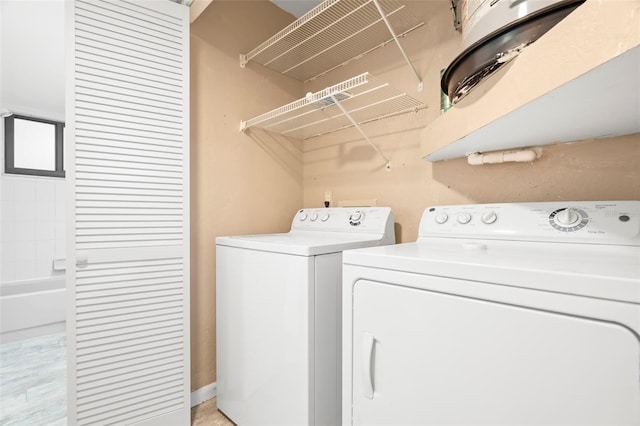 laundry area featuring washing machine and clothes dryer