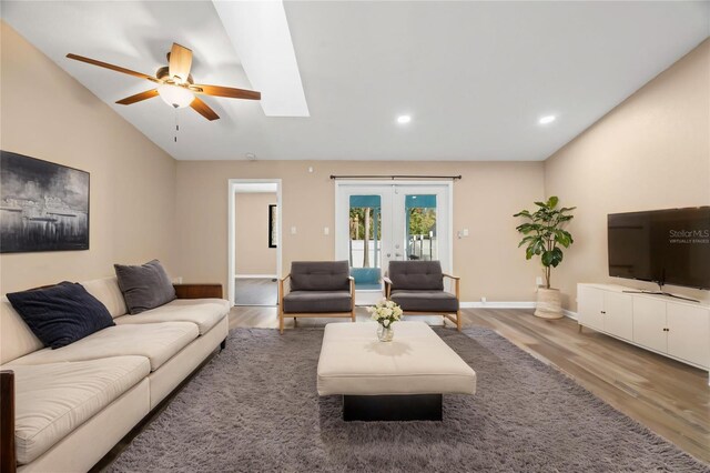 104 Anclote Rd Unit 104, Tarpon Springs, FL 34689 - living room featuring ceiling fan, baseboards, french doors, and wood finished floors