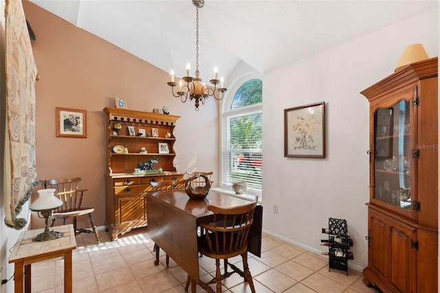 dining area with vaulted ceiling, light tile patterned flooring, baseboards, and a notable chandelier