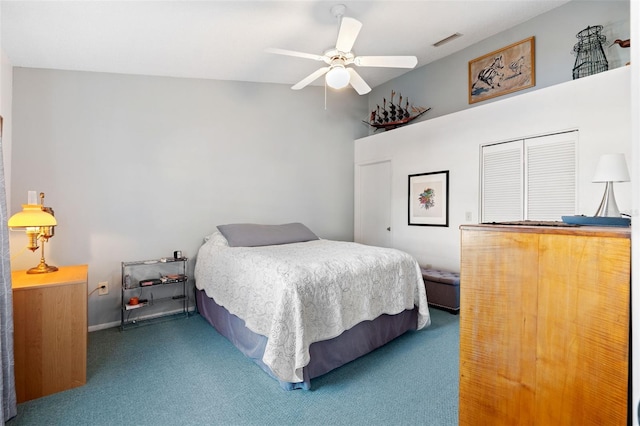 carpeted bedroom with visible vents and a ceiling fan