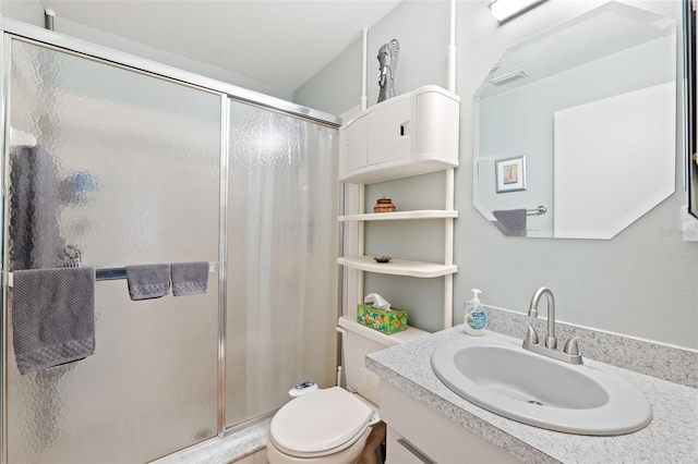 full bath with visible vents, vanity, toilet, and a shower stall