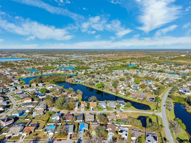 aerial view featuring a water view and a residential view